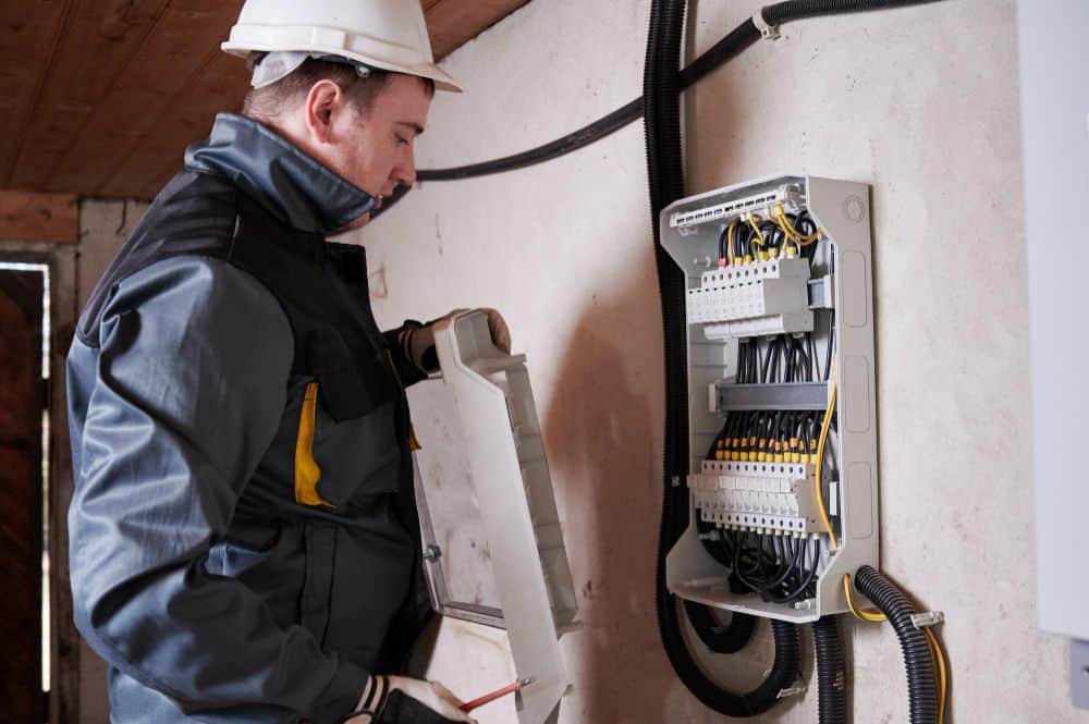 electrician-checking-switchboard-basement